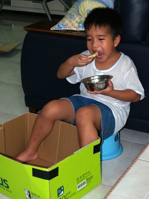 Julian eating in a box