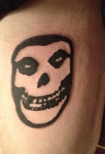 Misfits upper leg tattoo by Wes Fortier