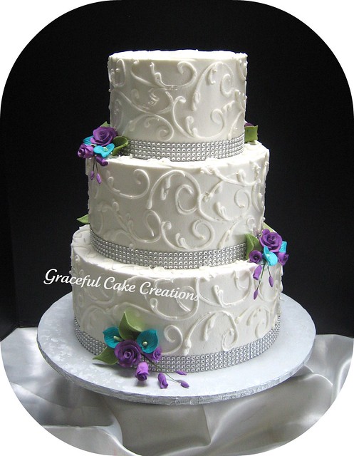 Elegant White Wedding Cake with Crystal Ribbon accented with Teal and Purple