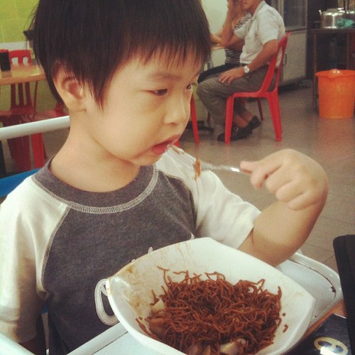 Boy enjoying fish ball noodles