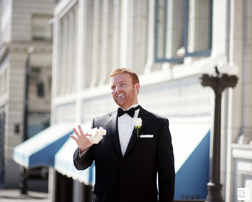 Groom Smiling with Gift