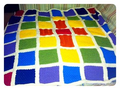 Knitted rainbow baby blanket.