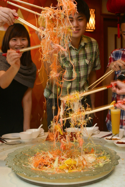 Lo hei! As high as you can!