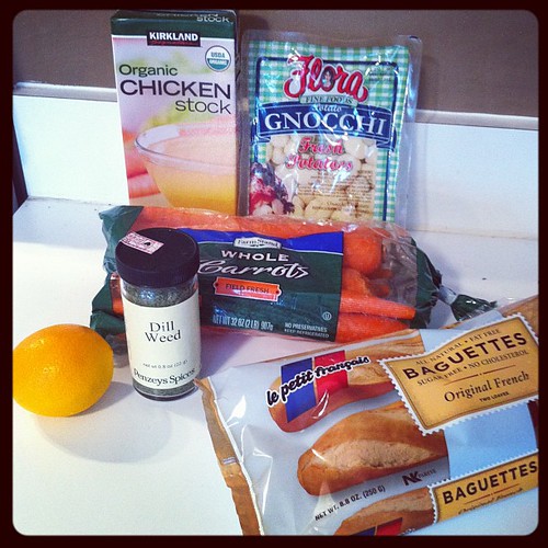 Ingredients to make homemade gnocchi soup are on the counter.