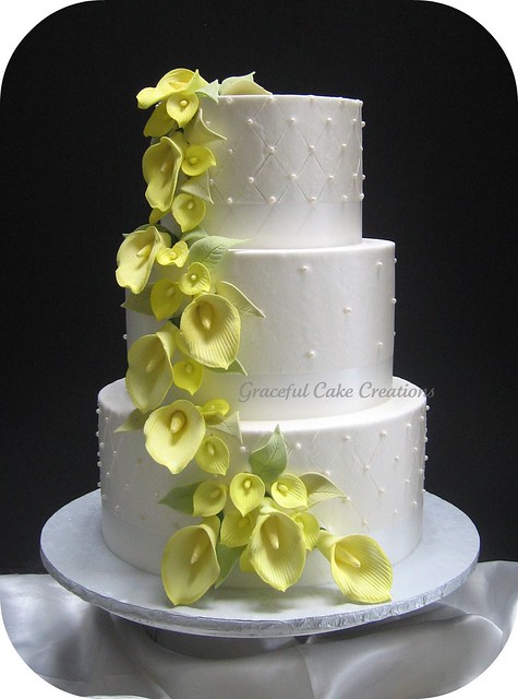 Elegant White Wedding Cake with Yellow Calla Lilies