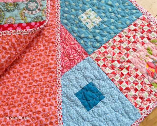 I Spy a Square Quilt folded with backing