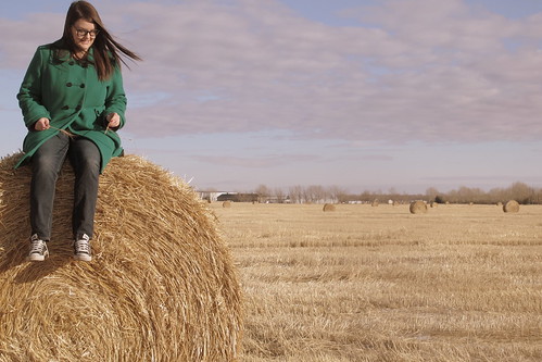 This is me sitting on a hay bale. Self-explanatory.