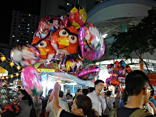 Angry Bird balloons looking evil.