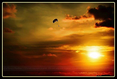 sunset parasail by Nancy Hawkins