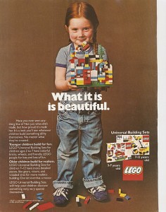 Old Lego ad showing young girl in overalls proudly holding her Lego creation. 