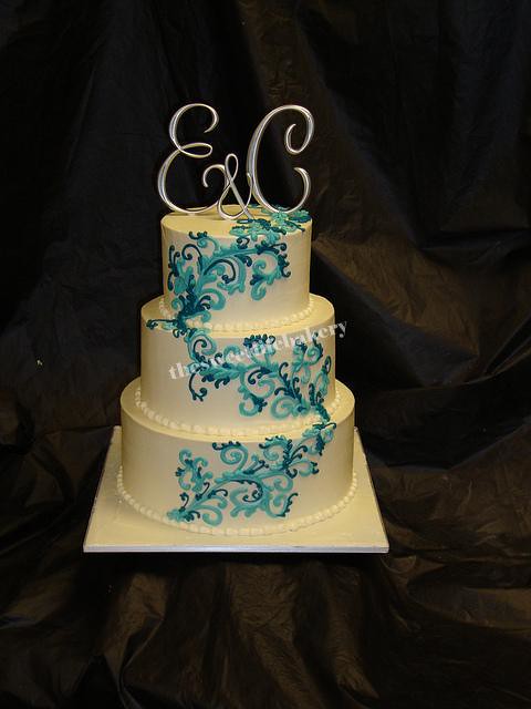 Teal and Blue Swirl Wedding Cake Light teal swirls accented with a dark 