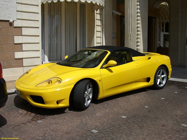 Yellow Ferrari 360 spider with a black soft top Just gorgeous