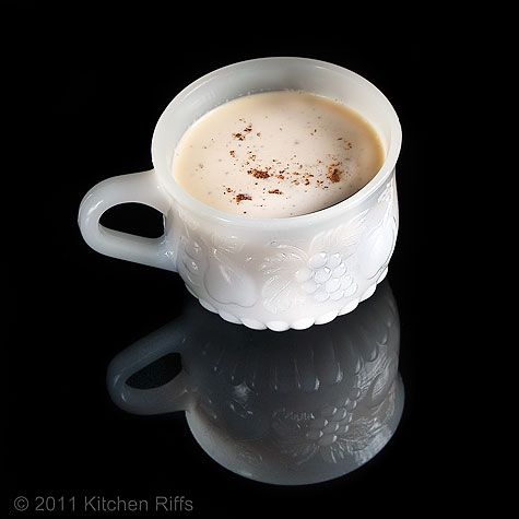 Eggnog in white punch cup on black acrylic
