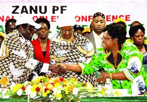 Republic of Zimbabwe Vice-President Joice Mujuru congratulates President Robert Mugabe on his concluding speech at the ZANU-PF 12th National People's Conference held in Bulawayo in early December 2011. The party stands poised for the elections. by Pan-African News Wire File Photos