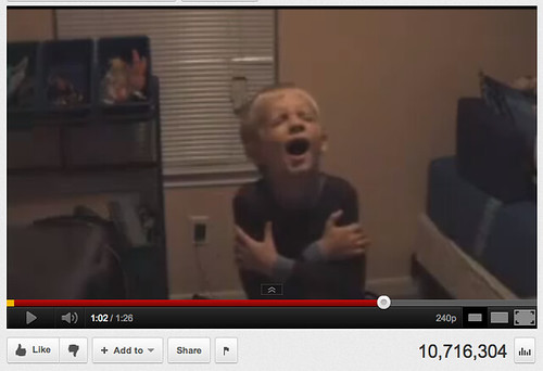 screen shot of the YouTube video--a young white boy with blond hair is dancing alone in his room