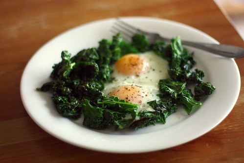 fried eggs and crispy kale