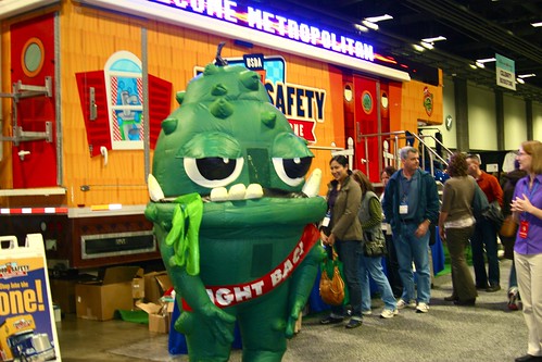 BAC!®, the Discovery Zone’s “green bacteria” mascot greets Metropolitan Cooking and Entertaining Show attendees as they line up to tour the interactive and educational Food Safety Discovery Zone. 