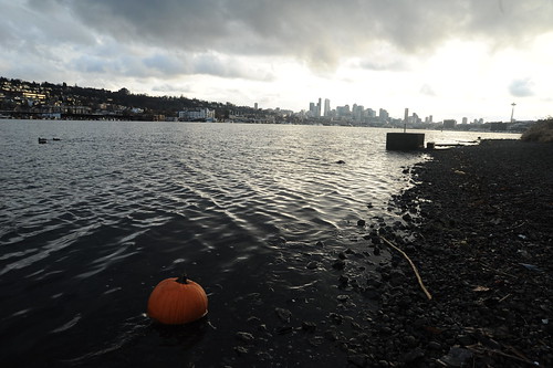 October party left overs in January, waterborn pumpkin, Gasworks Park, Lake Union, skyline, Seattle, Washington, USA by Wonderlane