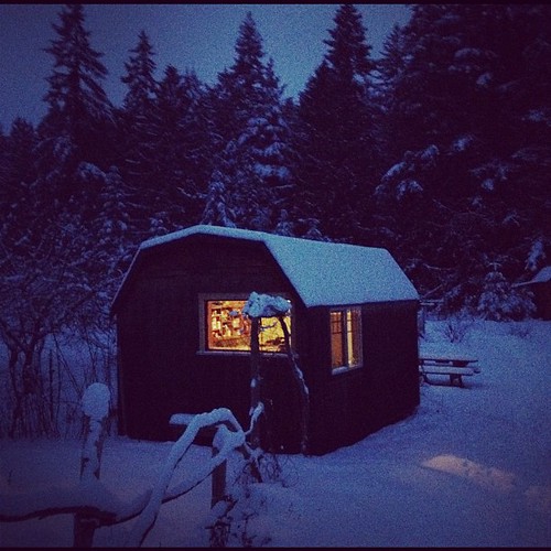 Cabin at dusk in the snow