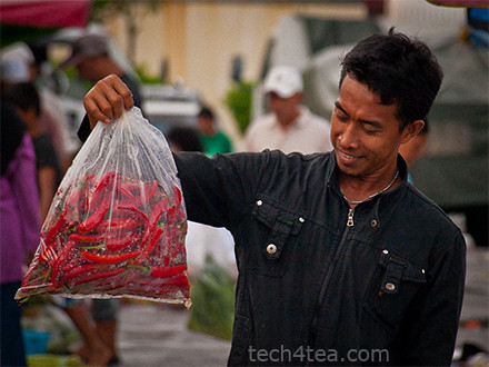 The vegetable market starts early at dawn by the seaside of Kota Kinabalu.