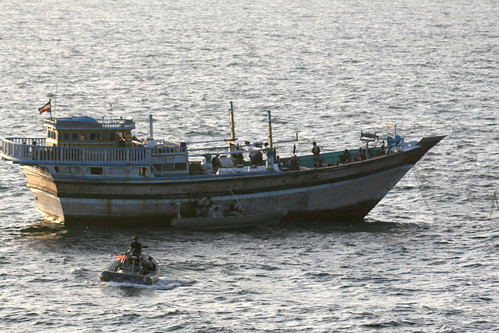 Sailors from USS Kidd assist an Iranian-flagged fishing dhow