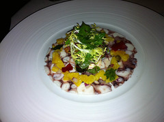 Octopus carpaccio, orange and ginger salsa with goujons and rocket