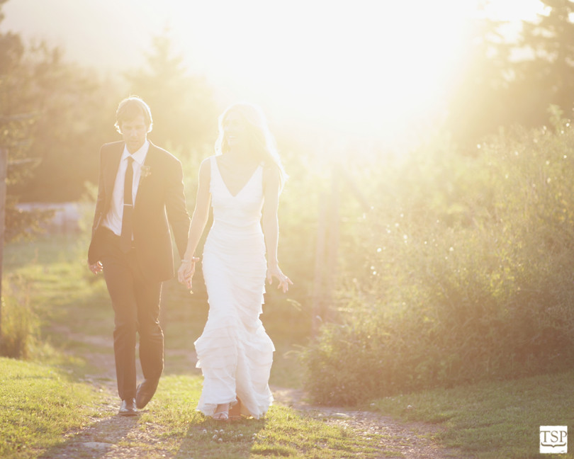 Bride and Groom Walking at Sunset