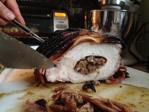 Bacon wrapped pork with stuffing.