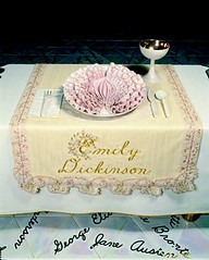 Place setting at the dinner party, with Emily Dickinson's name embroidered on the napkin