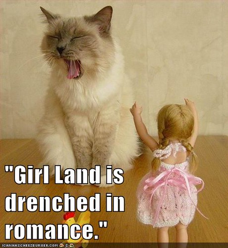 cat growling, quote reads Girl Land is drenched in romance.