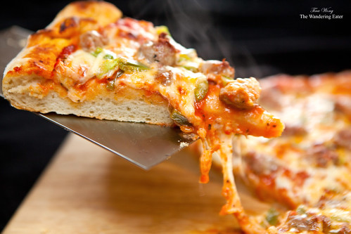 Gooey homemade sausage pepper and two-cheese pizza