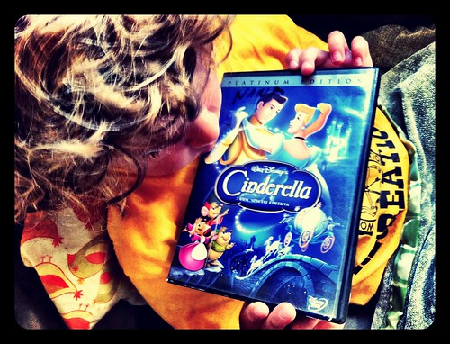 My son clutching his prized copy of Cinderella