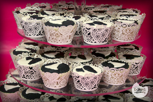 Each cupcake has an embossed top and a wedding dress or suit and top hat