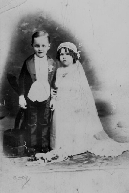 Reginald Hartigan and Clarice Johnson playing dressups in wedding costume 