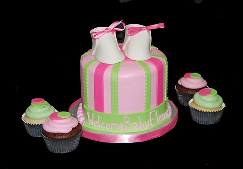pink and green baby shower cupcake tower with booties