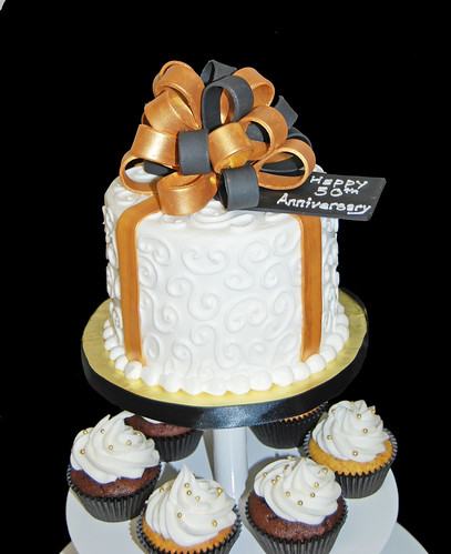 black and gold 50th wedding anniversary cupcake tower