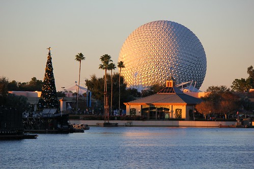Christmas tree, Spaceship Earth, and World Showcase Lagoon at sunset