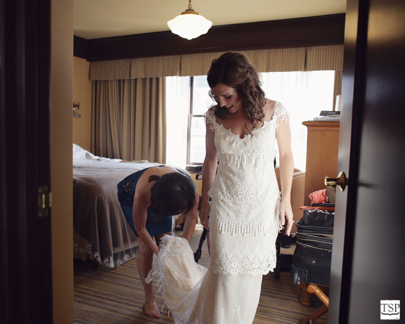 Mother of Bride Helping Bride with Dress