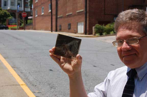 Bob Flippen holds one of the glass negatives