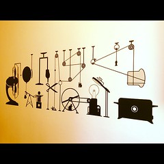 We have a Rube Goldberg / Heath Robinson toast machine as kitchen wall art!