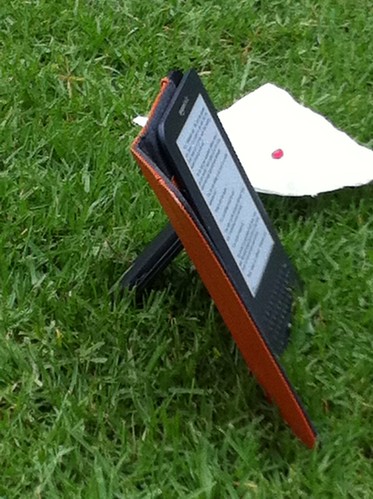 Kindle propped on mobile phone by ellen forsyth