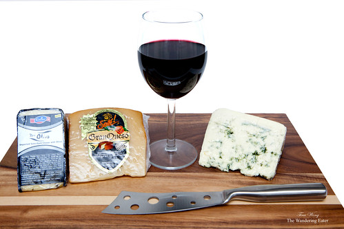 Gran Queso, Don Olivo, and Buttermilk Blue cheeses with a glass of Pinot Noir