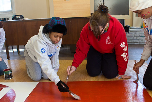 YouthBuild students and staff painting a mural for Opport-UNITY