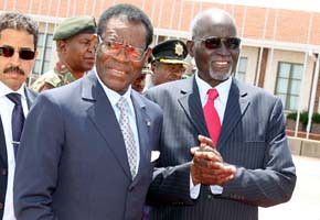 Zimbabwe Vice-President John Nkomo bids farewell to Equatorial Guinea President Teodoro Obiang Nguema at the Harare International Airport on January 10, 2012. The states signed a Memorandum of Understanding involving co-operation agreements. by Pan-African News Wire File Photos