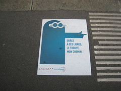 Accessibility signage and sidewalk grooves