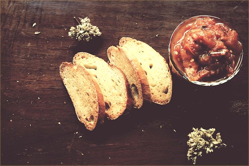 Crostini with Roasted Tomato and Garlic topping and Oregano Flowers