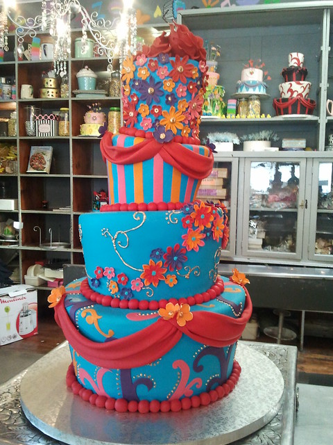 4tier Mad Hatter wedding cake covered in turquoise fondant decorated with
