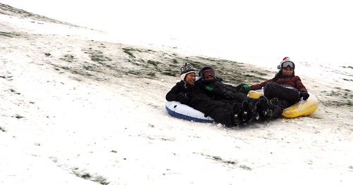 Inflatables as sleds, a trio sleds down the big hill, record snow fall day, Gas Works Park, Wallingford, Seattle, Washington by Wonderlane