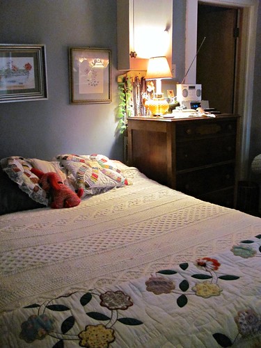 bed with rose of sharon quilt