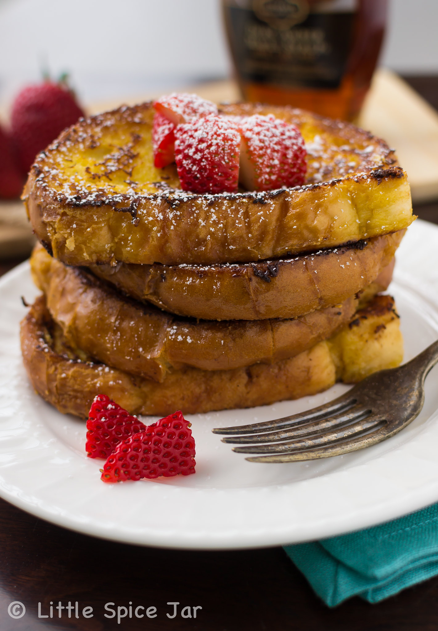 stack of French toast on white plate